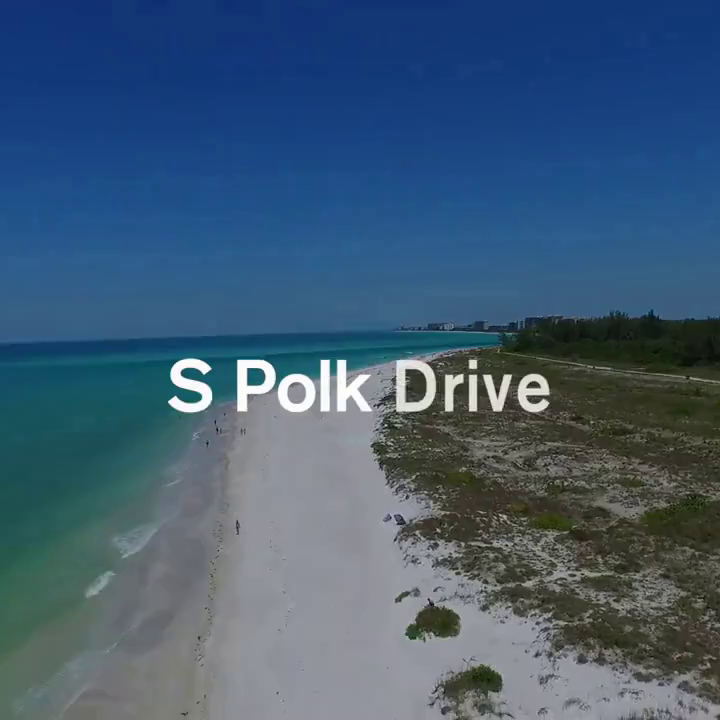a bright sandy beach and turquoise ocean meeting at a coastline